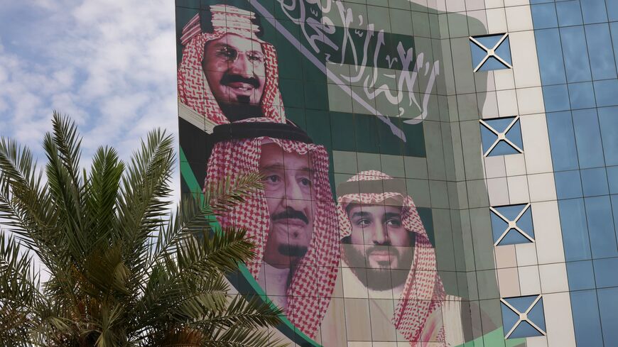 This picture shows a poster depicting King Abdulaziz bin Saud (L), the founder of the modern kingdom of Saudi Arabia, King Salman bin Abdulaziz (C), and Crown Prince Mohammed in Riyadh on April 16, 2023.