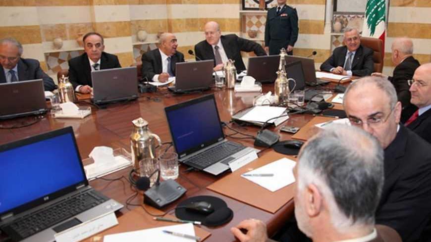 Lebanon's President Michel Suleiman (5th from bottom) presides a cabinet meeting at the presidential palace in Baabda, near Beirut January 3, 2013. Lebanon, now a haven for 170,000 Syrians fleeing civil war, has asked foreign donors for $180 million to help care for them and said it will register and recognise refugees after a year-long hiatus. The Beirut government has officially sought to "dissociate" itself from the 21-month-old struggle in Syria, nervous about the destabilising impact of the increasingl