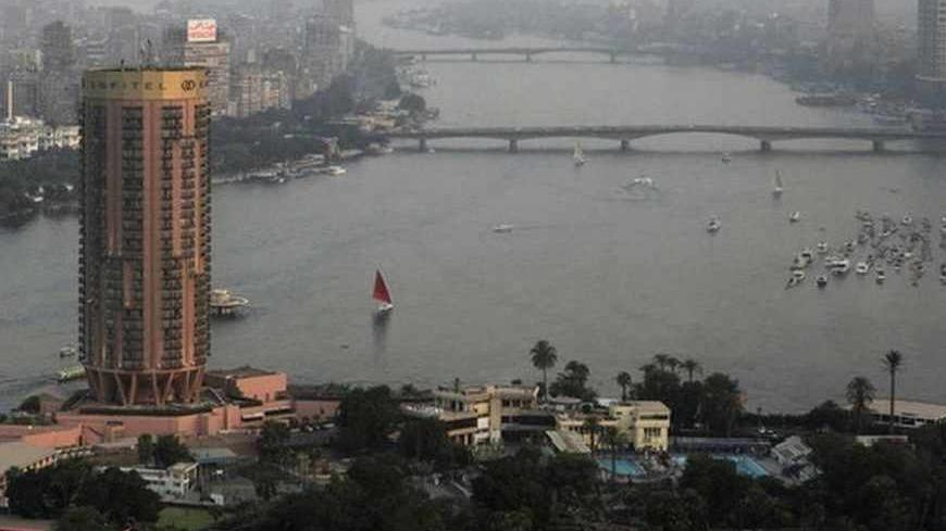 Boats sail on the river Nile in Cairo June 12, 2013. Most of Egypt's population live clustered around the Nile valley and delta, and the river is both a vital resource for the country's citizens, and a potent national symbol. In a recent dispute with Ethiopia over the construction of a dam upstream, Egypt's foreign minister Mohamed Kamel Amr underlined the country's reliance on the river's waters: "No Nile - no Egypt," he said. Picture taken June 12, 2013. REUTERS/Asmaa Waguih (EGYPT - Tags: POLITICS SOCIET