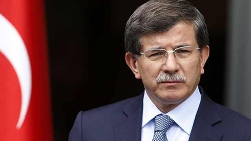 Turkey's Foreign Minister Ahmet Davutoglu addresses the media in Ankara June 13, 2013. REUTERS/Umit Bektas (TURKEY - Tags: POLITICS) - RTX10M6J