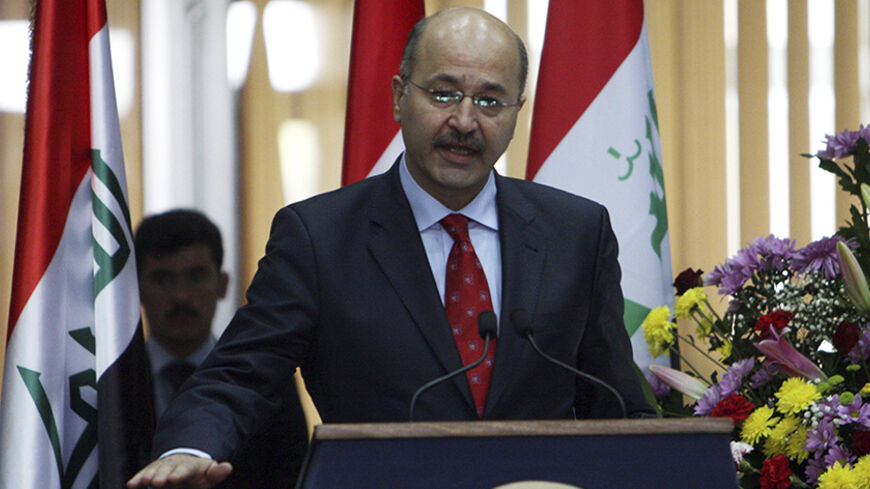 New Kurdish Prime Minister Bahram Salih takes an oath after his election by parliament to take office, in Abril, 310 km (190 miles north of Baghdad October 28, 2009.  After Kurdish parliamentary elections in July that kept the region's two major parties in power, Kurdish lawmakers have picked Iraq's former deputy prime minister, Barham Salih, to head the new government. Analysts say the move may bring a more cordial tone to tense ties between Kurds and majority Arabs in Baghdad.  REUTERS/Azad Lashkari (IRAQ