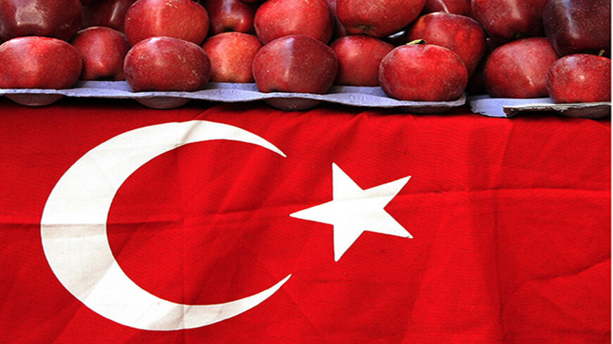 A Turkish flag decorates a grocer's stand on a street in Istanbul November 10, 2007. Turks throughout the country observed a minute of silence when sirens went off, marking the 69th death anniversary of Mustafa Kemal Ataturk, founder of modern Turkey. Ataturk, the first president of Turkey from 1923 and founder of the modern secular state, died on November 10, 1938. He was 57. REUTERS/Fatih Saribas (TURKEY) - RTX6CA