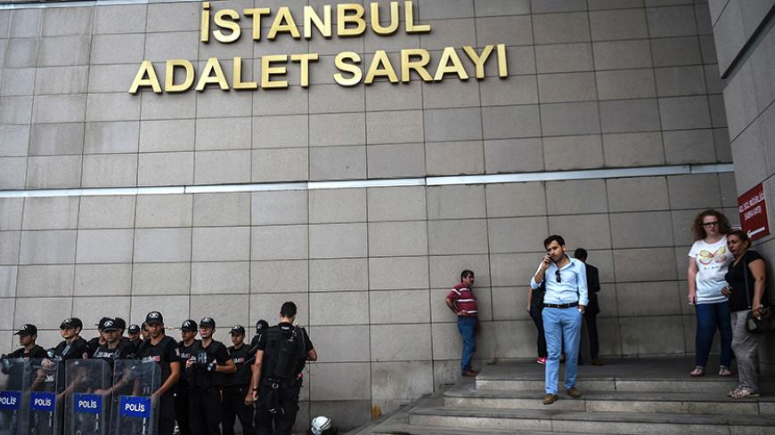 Turkish police stands guard in front of the Istanbul courthouse on July 20, 2016 following the military coup attempt of July 15.
Turkish President Recep Tayyip Erdogan was today to chair a crunch security meeting in Ankara for the first time since the failed coup, with tens of thousands either detained or sacked from their jobs in a widening purge. / AFP / BULENT KILIC (Photo credit should read BULENT KILIC/AFP/Getty Images)