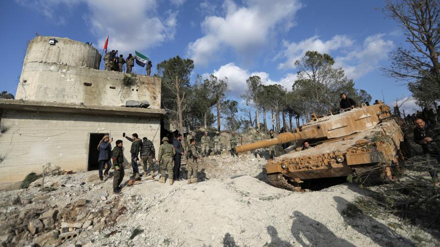 Turkish forces and Free Syrian Army members are seen on Mount Barsaya, northeast of Afrin, Syria January 28, 2018. REUTERS/ Khalil Ashawi - RC12885992C0
