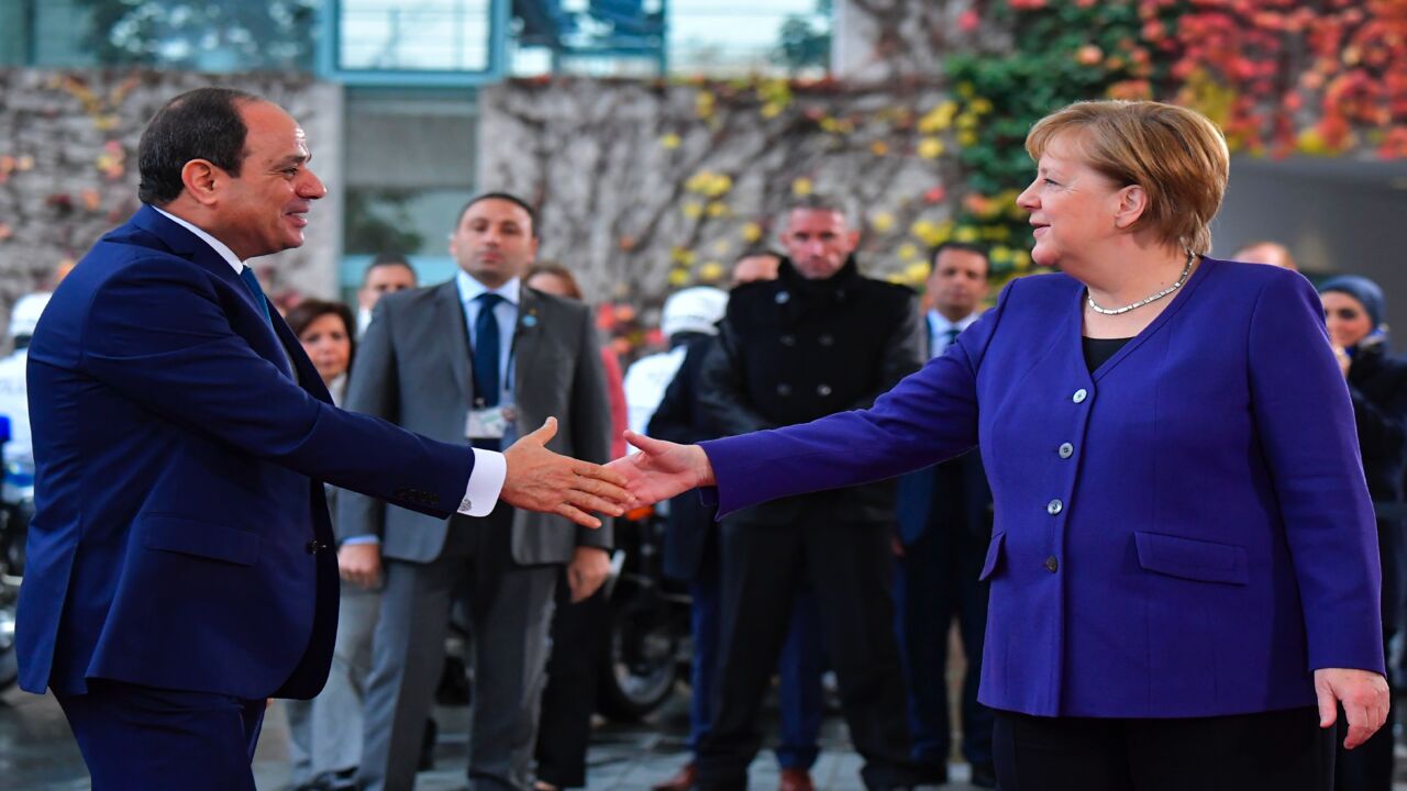 German Chancellor Angela Merkel (R) greets Egypt's President Abdel Fattah al-Sisi (L) upon his arrival for a meeting at the Chancellery in Berlin on Nov. 20, 2019.