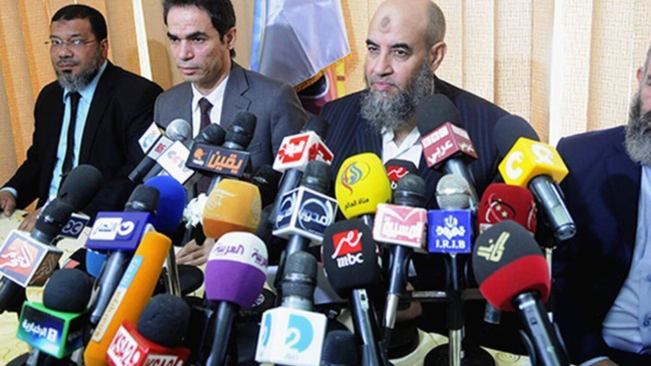 EGYPT-PROTESTS/ Younes Makhyoun (2nd R), head of the Salafist al-Nour Party attends a news conference with Presidential Media Advisor and spokesman Ahmed al-Muslimani (2nd L) at the party's headquarters in Cairo August 28, 2013. During the conference, Makhyoun stated that the Egyptian armed forces are a red line and reiterated al-Nour's support of the army's roadmap back to democracy, according to local media. Picture taken August 28, 2013. REUTERS/Stringer (EGYPT - Tags: POLITICS MEDIA) - RTX12ZWG