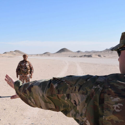 Master Sgt. Richard Harris, 149th Military Engagement Team, Kentucky National Guard, places Royal Army of Oman soldiers in different formations to demon-strate tactical movement for a variety of scenarios during a Mountain Warfare Information Exchange, May 9, 2017, near Salalah, Oman. (U.S. Army Photo by Staff Sgt. Joshua Atanovich, 149th Military Engagement Team)
