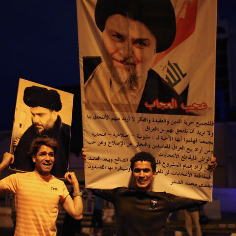 Iraqi supporters of Sairun list celebrate with portraits of Shi'ite cleric Moqtada al-Sadr, after results of Iraq's parliamentary election were announced in Baghdad, Iraq May 14, 2018. REUTERS/Thaier al-Sudani     TPX IMAGES OF THE DAY - RC1278A66440